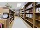 A charming library filled with bookshelves stacked with literature, providing a quiet reading and study space at 2457 Ecuadorian Way # 63, Clearwater, FL 33763