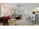 Inviting living room features a ceiling fan, light wood floors, and dining area at 2457 Ecuadorian Way # 63, Clearwater, FL 33763