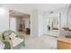 Inviting living room featuring wicker furniture and a view into the adjacent bedroom at 2457 Ecuadorian Way # 63, Clearwater, FL 33763