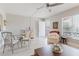 Open-concept living room with dining area, white walls and plenty of natural light at 2457 Ecuadorian Way # 63, Clearwater, FL 33763