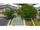 Aerial view of shuffleboard courts with benches and trees in a friendly community setting at 2457 Ecuadorian Way # 63, Clearwater, FL 33763