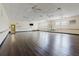 Spacious studio with hardwood floors, ceiling fans, and natural light offers a versatile space for activities at 2457 Ecuadorian Way # 63, Clearwater, FL 33763