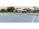 Close-up view of a tennis court with nets, perfect for an active lifestyle at 2457 Ecuadorian Way # 63, Clearwater, FL 33763