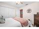 Cozy bedroom featuring a spacious closet and a tree art piece at 2597 Bramblewood E Dr, Clearwater, FL 33763