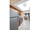 Bright and well-maintained kitchen boasts stainless steel appliances, stylish countertops, and direct access to dining room at 2597 Bramblewood E Dr, Clearwater, FL 33763