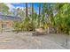 Backyard with brick patio, lush landscaping, and a cozy seating area at 273 Shore Dr, Palm Harbor, FL 34683