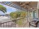 Charming balcony with ample seating, offering a relaxing outdoor space with a water view at 273 Shore Dr, Palm Harbor, FL 34683