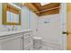 Bright bathroom features a walk-in shower, white vanity, and warm wood ceiling at 273 Shore Dr, Palm Harbor, FL 34683