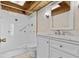 Bathroom with white vanity, tile floor, and walk-in shower featuring decorative accents at 273 Shore Dr, Palm Harbor, FL 34683
