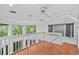 Second story loft overlooking the downstairs area with wood floors and lots of natural light at 273 Shore Dr, Palm Harbor, FL 34683