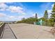 Expansive roof with metal railing offers stunning panoramic views of the surrounding landscape and water at 273 Shore Dr, Palm Harbor, FL 34683