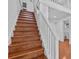 Bright staircase features wooden steps with white risers, complementing the home's stylish interior at 273 Shore Dr, Palm Harbor, FL 34683