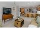 Spacious living room that opens up to the kitchen with tile floors at 2831 Quail Hollow W Rd, Clearwater, FL 33761