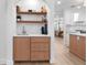 Dry bar features wooden shelving, drawers, and a wine cooler at 2850 Allapattah Dr, Clearwater, FL 33761