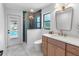 Stylish bathroom with a glass shower, backyard access and a modern vanity, creating a spa-like retreat at 2850 Allapattah Dr, Clearwater, FL 33761