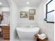 Bright bathroom showcases a freestanding tub, accent wall tile, and modern fixtures at 2850 Allapattah Dr, Clearwater, FL 33761