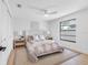 Bright bedroom featuring a neutral color palette, ceiling fan, and black framed window at 2850 Allapattah Dr, Clearwater, FL 33761
