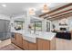 Well-designed kitchen with an island, stainless steel fridge, and open layout at 2850 Allapattah Dr, Clearwater, FL 33761