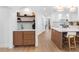 Inviting kitchen features island seating, white cabinets and is adjacent to a bar area at 2850 Allapattah Dr, Clearwater, FL 33761