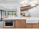 Spacious kitchen with a large island, farmhouse sink, and updated appliances at 2850 Allapattah Dr, Clearwater, FL 33761