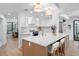 Bright kitchen features custom cabinets, an island with seating, and stainless steel appliances at 2850 Allapattah Dr, Clearwater, FL 33761
