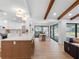 Open concept kitchen with a breakfast bar, modern design, and seamless flow to the dining area at 2850 Allapattah Dr, Clearwater, FL 33761