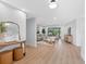 Open concept living room with modern furniture, updated flooring, and natural light at 2850 Allapattah Dr, Clearwater, FL 33761