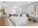 Spacious bedroom with new flooring and light paint creating a comfortable retreat at 2850 Allapattah Dr, Clearwater, FL 33761