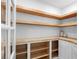 Walk-in pantry with custom wood shelving and ample storage space at 2850 Allapattah Dr, Clearwater, FL 33761