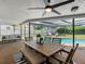 Relaxing patio area with outdoor seating, a dining table, and a view of the sparkling pool at 2850 Allapattah Dr, Clearwater, FL 33761