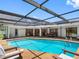 Sparkling blue pool surrounded by a spacious patio and lounge chairs, perfect for outdoor relaxation at 2850 Allapattah Dr, Clearwater, FL 33761