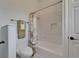 Clean bathroom with a tiled shower/tub combo with white fixtures at 3060 Sutton Woods Dr, Plant City, FL 33566