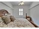 Bedroom featuring wood floors and furniture at 3060 Sutton Woods Dr, Plant City, FL 33566