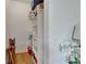 Walk-in closet with shelving, storage, and wood-style flooring at 3060 Sutton Woods Dr, Plant City, FL 33566