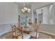 Bright dining room featuring classic furnishings and natural light, view of living room at 3060 Sutton Woods Dr, Plant City, FL 33566
