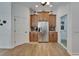 Spacious kitchen showcasing wood cabinets, stainless steel appliances and stylish backsplash at 3060 Sutton Woods Dr, Plant City, FL 33566