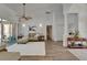 Bright living room with neutral furniture and a view of the outdoor pool area at 3060 Sutton Woods Dr, Plant City, FL 33566