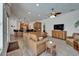 Inviting living room with fireplace, comfortable seating, open to the kitchen with bar seating at 3060 Sutton Woods Dr, Plant City, FL 33566