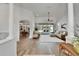 Open-concept living room featuring natural light, flowing into adjacent dining area at 3060 Sutton Woods Dr, Plant City, FL 33566