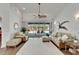 Bright living room featuring neutral furniture and view of the screened-in pool at 3060 Sutton Woods Dr, Plant City, FL 33566