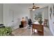 Home office featuring natural light from the window and wood-look tile flooring at 3060 Sutton Woods Dr, Plant City, FL 33566