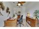 Bright office space with decorative plants, ceiling fan, and access to other areas at 3060 Sutton Woods Dr, Plant City, FL 33566