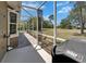 Covered patio with outdoor shower, brick flooring, and screened enclosure offering a relaxing outdoor space at 3060 Sutton Woods Dr, Plant City, FL 33566