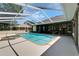 Gorgeous screened-in pool and spa area with ample space for entertaining and a beautiful clear blue pool at 3060 Sutton Woods Dr, Plant City, FL 33566