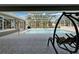 Relaxing shaded pool and spa area in a screened-in enclosure with a comfortable lounge chair at 3060 Sutton Woods Dr, Plant City, FL 33566