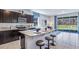 Eat-in kitchen features modern appliances, counter seating, and views to the exterior at 32429 Welling Blade Loop, Wesley Chapel, FL 33545