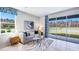 Bright living room features neutral tones, stylish decor and views of the tranquil water at 32429 Welling Blade Loop, Wesley Chapel, FL 33545