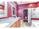 Bathroom featuring double sinks, a glass shower, and a separate closet at 3292 Covered Bridge E Dr, Dunedin, FL 34698