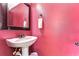 Charming powder room with a pedestal sink and unique decor at 3292 Covered Bridge E Dr, Dunedin, FL 34698