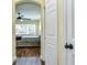 Hallway with a bedroom view including wood floors, ceiling fan, and natural light at 3292 Covered Bridge E Dr, Dunedin, FL 34698